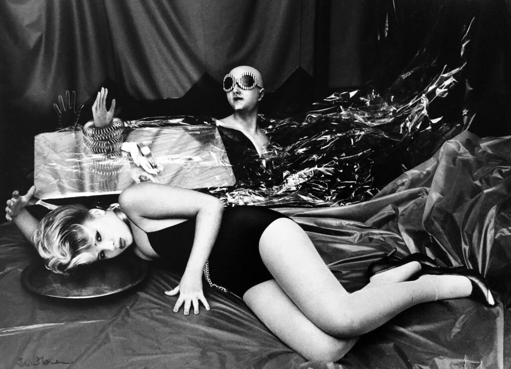 In this limited edition silver gelatin print, photographer Irina Ionesco uses ordinary objects to set an intriguing scene with her daughter Eva Ionesco as her model. Unfortunately, the photograph was torn in two places during transit to the United States and sustained some damaged. Still, it is a prime example of the talent of both Irina and Eva.