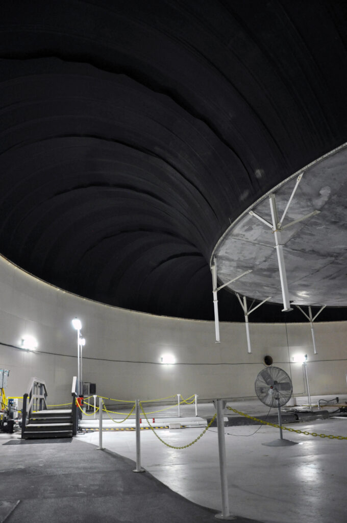 Inside one of the two lungs at the Biosphere 2 Center. The air pressure changes throughout the day as it heats and cools and the aluminum disc rises and falls accordingly. Photo by Michael Aaron Gallagher, taken in 2019.