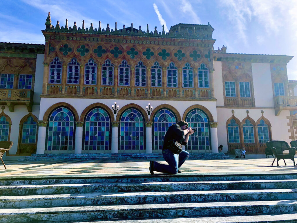 Photographer Michael Aaron Gallagher taking pictures on the marble terrace at Ca’ d’Zan in Sarasota, Florida.