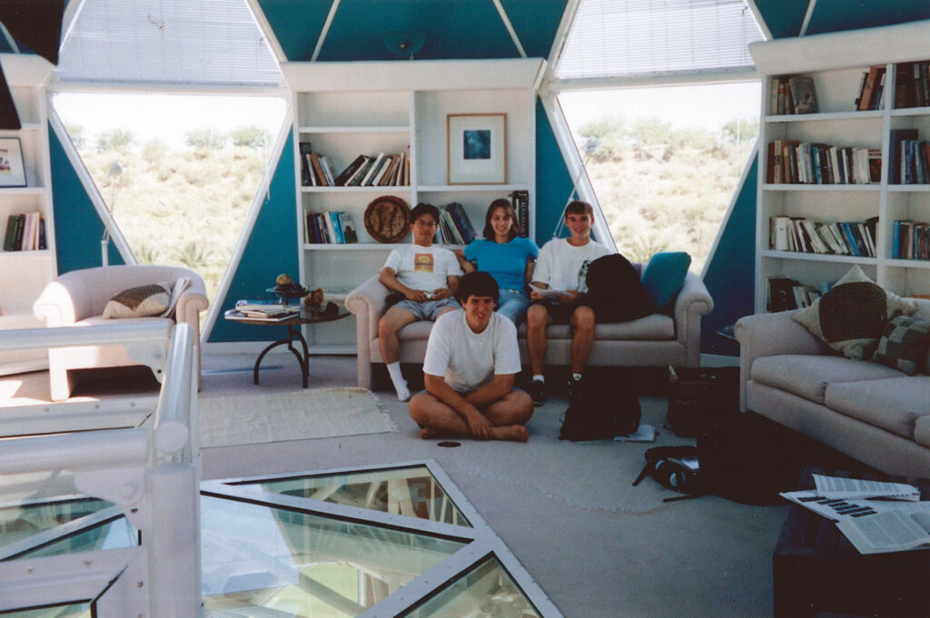 Michael Aaron Gallagher (far right) sitting next to Alexandra Vasilescu and the rest of his study group in the restricted area of the library tower inside the human habitat of the Biosphere 2 Center in 1998.