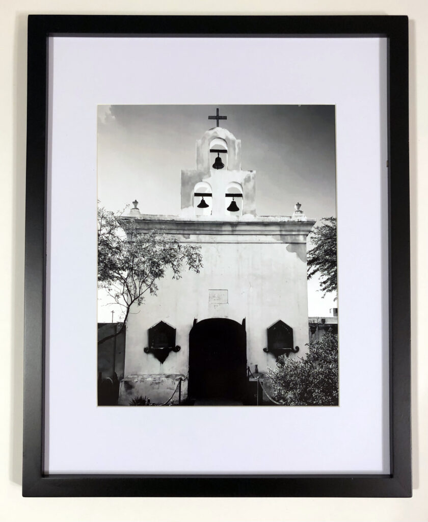 “Mission San Xavier del Bac Chapel, Sonoran Desert, Arizona” (2019) by Michael Aaron Gallagher. An 8” x 10” photograph taken with an iPhone 8.