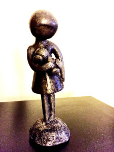 “Girl with Teddy Bear” sculpture.