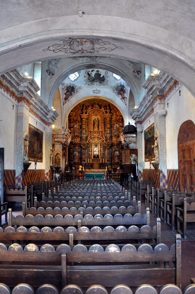 Pews inside the church by Michael Aaron Gallagher