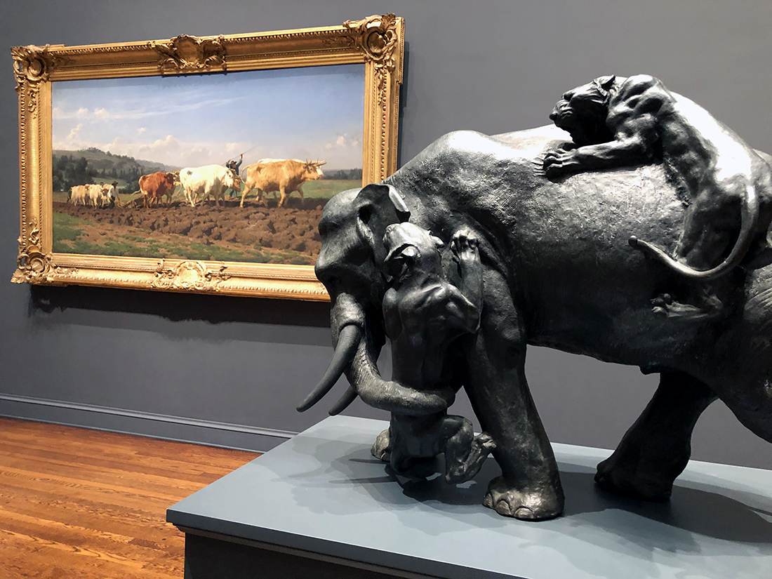 "Plowing in the Nivernais (Labourages nivernais)" oil painting from 1850 by Rosa Bonheur and “Elephants Attacked by Two Tigers” patinated bronze sculpture from 1890 by Japanese artist Makino Kōshū at The John and Mable Ringling Museum of Art. Photo by Michael Aaron Gallagher.