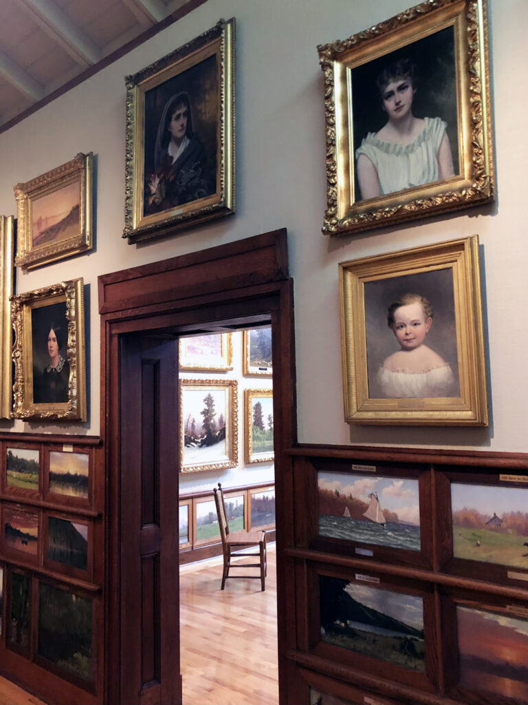 Portraits around the doorway at the John D Barrow Art Gallery by Michael Aaron Gallagher